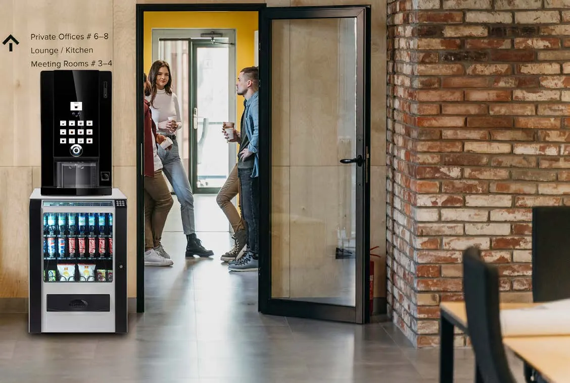 Machine à café Doppio et distributeur Snack Piccola près d'une entrée de bureau